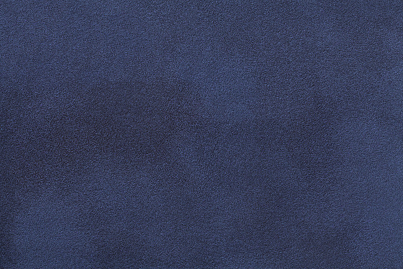 海军蓝无光麂皮织物特写。天鹅绒质地。