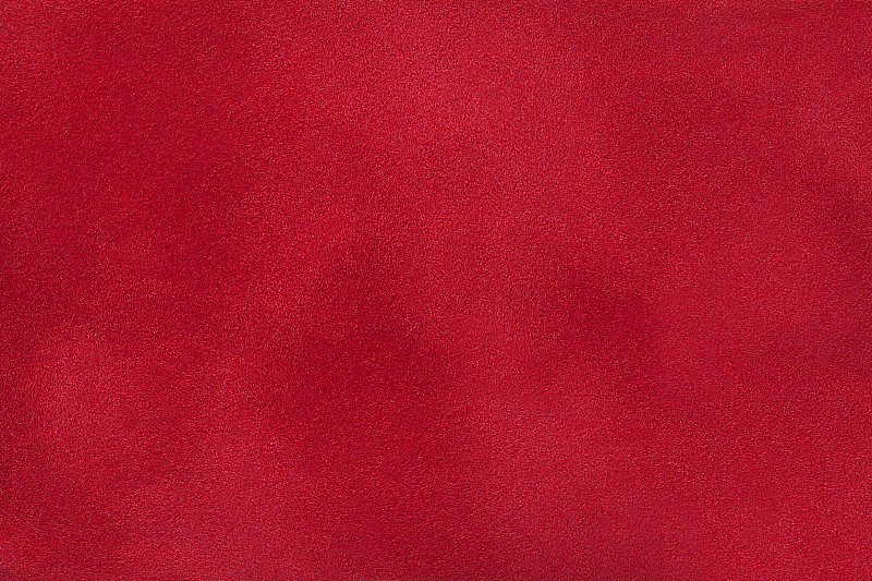 暗红色哑光绒面革织物背景，特写。