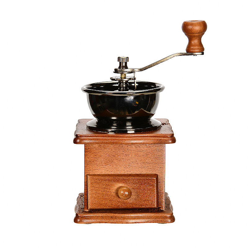 老式的传统手工咖啡研磨机。特写，孤立在白色背景上。
