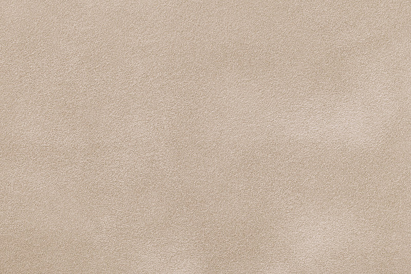 浅米色哑光麂皮织物背景，特写。
