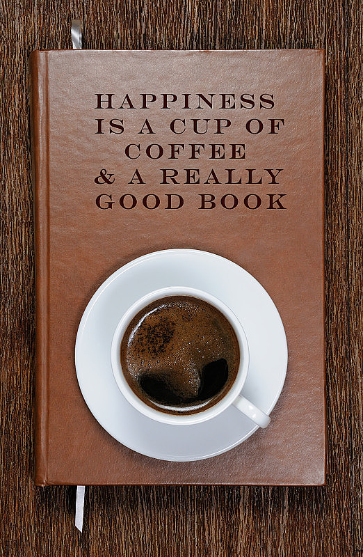 幸福就是一杯咖啡和一本好书。一本有励志名言和一杯咖啡的书